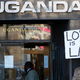 An activist holds a banner during a gay rights protest outside Uganda House in Trafalgar Square, in London December 10, 2009.